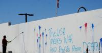Wall of US Embassy in Brazil's capital is vandalized as relations remain tense