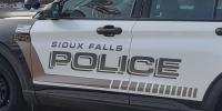 Woman arrested after pointing a gun at others in a Sioux Falls parking lot