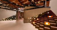 former textile warehouse transforms into fractal-inspired jaipur rugs showroom in mumbai