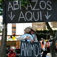 Free hugs ease heartache in Colombia's quake zone