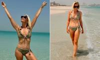 A Place In The Sun host Laura Hamilton shows off her gym-honed physique as she strips down to a tiny bikini while on holiday in Abu Dhabi