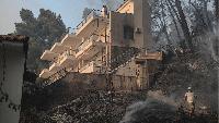 Tourists flee as Greek wildfire hits resort