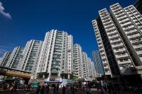 Hong Kong's CK Asset Plunges After First-Half Profit From Property Sales Drops 57%