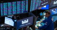 Wall Street slips from its record following the latest weak update on the U.S. economy
