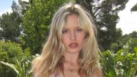 Georgia May Jagger shows off rock-hard abs in string bikini in candid moment from family holiday with son Dean, 2