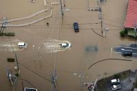 Heavy rain causes flooding near Tokyo that kills at least five, strands travellers
