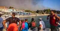 Tourists flee blazes in Greece as fire hits bomb-riddled forest in Germany