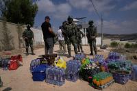 World Associated Press Palestinians besieged in West Bank village fear Israeli settlers will seize their homes