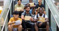 College students celebrate success after receiving exam results