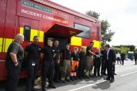 In town hit by wildfire, PM says UK must 'face up to climate change'