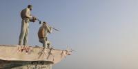 Iran says the Strait of Hormuz is shut down. The Trump administration says 9 million barrels a day are still getting out