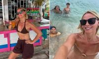 Kimberley Walsh displays her fit physique in stylish swimwear as she soaks up the sun during idyllic family holiday to Barbados