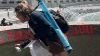 Woman faces federal charges after World War II Memorial vandalism An arrest has been made after the World War II Memorial in Washington, D.C., was vandalized with red paint and a substance that caused a fountain to bubble.