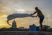 Cubans find rest on rooftops as blackouts drive them from home