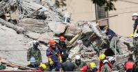 Colombia quake rescuers intensify efforts to save four people trapped in collapsed hotel