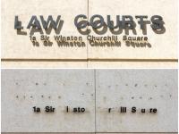 Vandals snatch signage off side of Edmonton Law Courts building