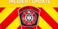 Firefighters suppress blaze inside a 53-foot semi-trailer at Waste Management transfer station