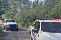 Woman, 20, revived after getting trapped underwater while crossing flooded bridge in Arizona