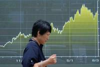 Wall Street holds near record following weak update on economy