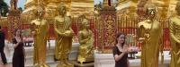 Tourist poses beside a Buddha at Doi Suthep and accidentally nails the pose