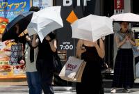AC vests and UV parasols: East Asia deploys heat-fighting gadgets