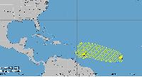 Caribbean System Weakens, New Wave Emerges