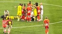 Ex-Arsenal star rushed to hospital with 'broken eye socket' as medics run to halt match