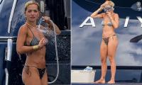 Rita Ora shows off her incredible figure in a mismatched bikini before enjoying a spot of snorkelling during sun-soaked yacht trip with pals in Ibiza