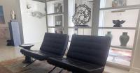 The iconic Barcelona and Brno chairs can bring life to a mid-century modern home
