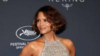 Halle Berry, 60, looks stunning in cheeky see-through white gown on tropical holiday