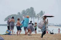 Travelers hunkered down as Hurricane Lala approached