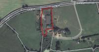 Fresh bid for new homes on village farm... with one house fewer than original plans