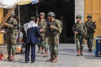 Israeli forces raid Hebron, force Palestinians to close shops