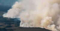 Firefighters battle massive wildfires in Belgium and Greece as 2 die on an island near Athens