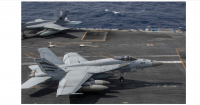 Top US Middle East commander visits long deployed aircraft carrier