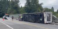 Truck pulling travel trailer rolls on Highway 26 overpass near Oregon Zoo