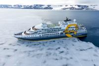 Quark Ships Catch Solar Eclipse Above Greenland