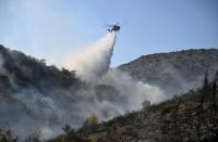 Two dead and hundreds evacuated after wildfires on Greek island
