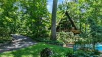 ‘Magical’ New York A-Frame With Secret Gardens and ‘Breathtaking’ Walls of Glass Is Listed for $1.7 Million