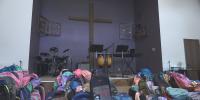 Local church gives over 1,000 backpacks to students in need.