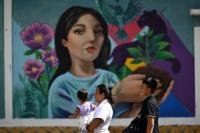 Winning back walls from gangs, artists fill El Salvador's towns with colour