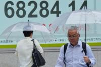 Asian shares are mostly higher while U.S. futures and oil prices hold steady