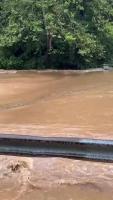 Raging Creek Breaks Banks Flooding West Virginia Road