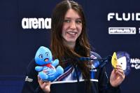 Scottish swimmer strikes double gold to put Britain top of the medals table