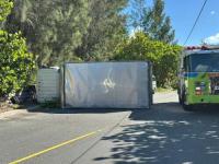 Truck overturns on South Road after hitting two vehicles