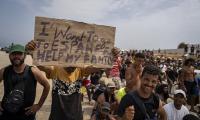 Spanish police investigate 15 sex assaults in Ceuta including against ten-year-old girl as hundreds of homeless migrants stage protest demanding asylum
