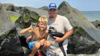 Father and son find monster shark tooth on beach as museum confirms rarity