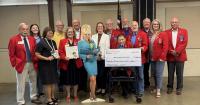 Charitable organization presents funds to keep Imagination Library delivering books to local areas