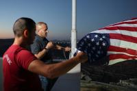 Palestinian-American raises US flag upon return to Qusra home besieged by settlers
