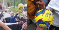 Colombia's president hands out branded footballs in an earthquake-hit port city